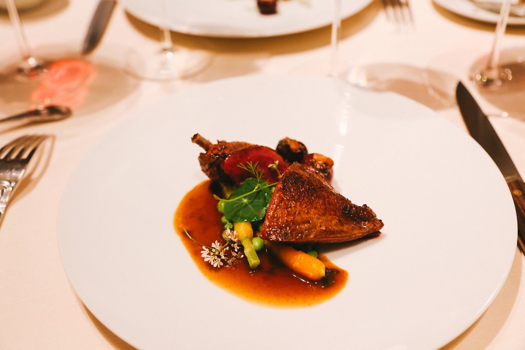 Pigeon with prune- and nut-stuffed cherries with carrots & peas in a jasmine-infused jue